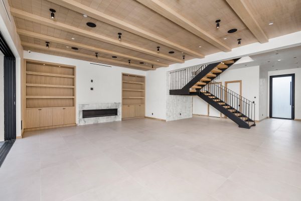 Cozy living room with elegant wooden staircase