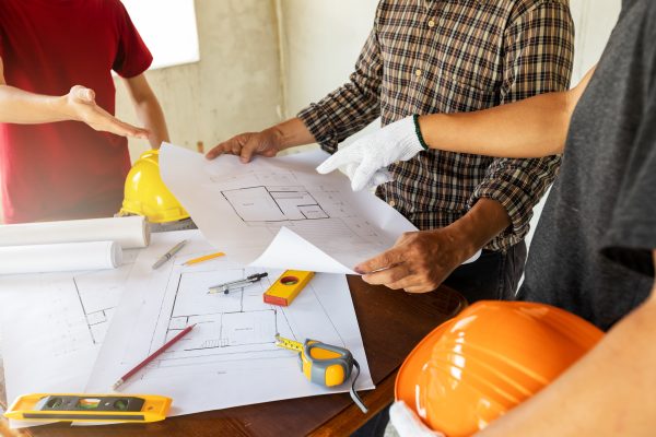 Architect discuss with engineer about project in office, architectural concept